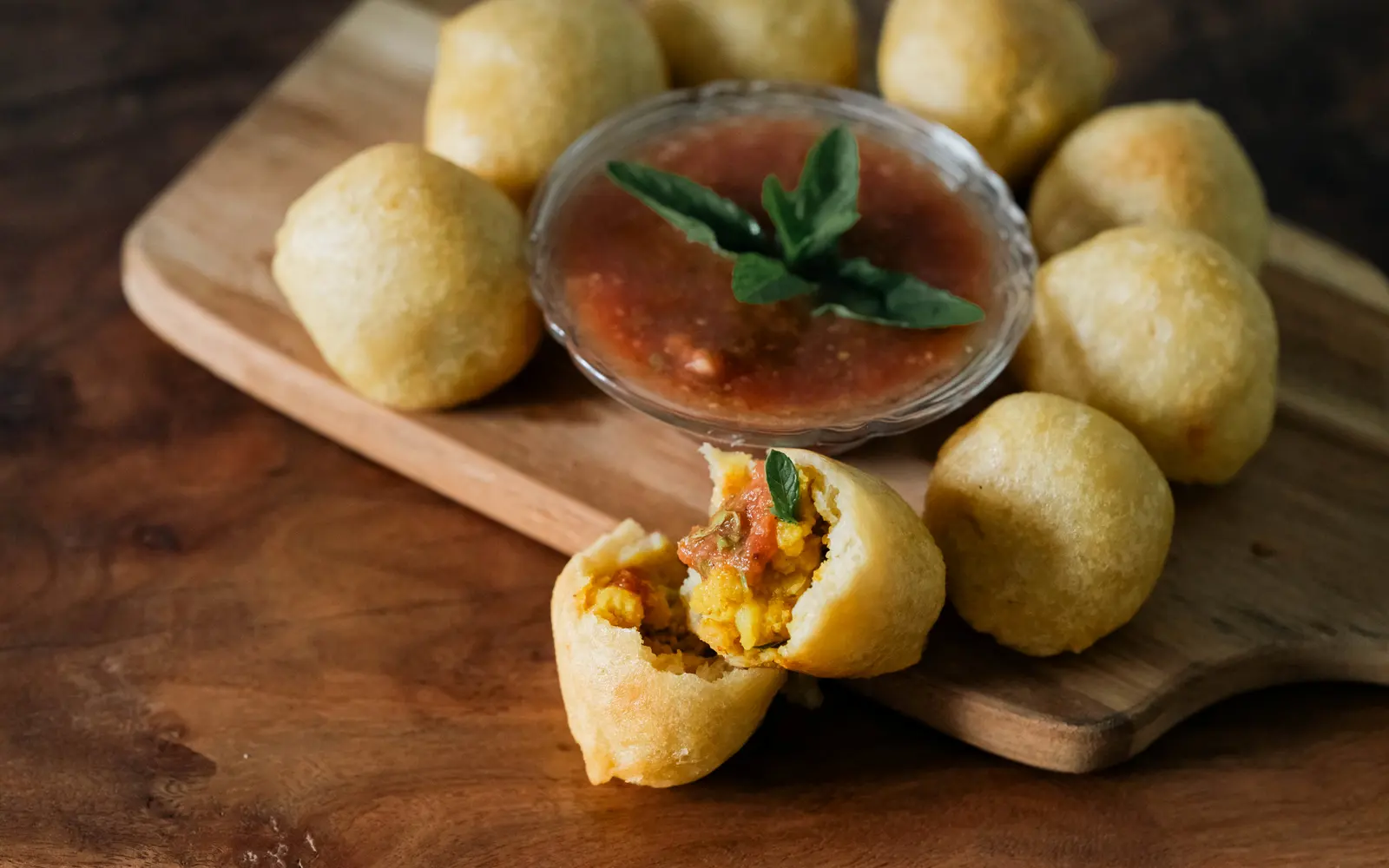 A spread of golden chana puri served with chutney